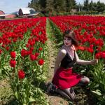 Heidi Klein poses for photos shot by her friend Meaghan Wright at Tulip Town on Thursday. The two, who are from Whidbey Island, are working on a book project. (Andy Bronson / The Herald)