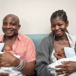 Adeboye and Ajibola Taiwo hold two of their sextuplets. (Allen Jones / Courtesy of VCU Medical Center)