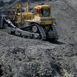 A bulldozer moves coal at an Alpha Natural Resources Inc. coal preparation plant in Logan County near Yolyn, West Virginia. (Luke Sharrett / Bloomberg News)