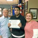 South Everett-Mukilteo Rotary Club member Paul Kulle (left) and president-elect Julie Frauenholtz (right) congratulate Student of the Month, Faisal Thalib, from ACES High School. (Contributed photo)