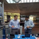 Two participants in Fluke Roadshow 2017 talk outside a booth set up in the lobby of the Fluke campus in Everett. The roadshow was an opportunity to talk about connectivity and smart maintenance in factories. (Contributed photo)
