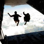 Jan. 27, 2006 CLARK AIR BASE, Philippines &mdash; U.S. Marine Master Sgt. Daniel P. Furiak and Peter Strinden perform jump together out of a U.S. Marine Corps KC-130 Hercules aircraft during a High Altitude-Low Opening jump Feb. 27 as part of Exercise Balikatan 2006. HALO is a tactical jumping technique in which the parachutist opens their parachute at a low altitude after free-falling for a period of time. Furiak is the paraloft chief for 3rd Reconnaissance Battalion, 3rd Marine Division. Strinden is the parachutes project officer for Marine Corps Systems Command.