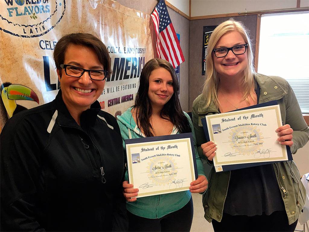 South Everett-Mukilteo Rotary President Cassie Franklin (from left) congratulates Sierra Heath and Gracie Smith, both ACES High School seniors, as Students of the Month. (Contributed photo)