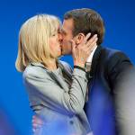 In this April 23 photo, French centrist presidential candidate Emmanuel Macron kisses his wife, Brigitte, before addressing his supporters at his election day headquarters in Paris. (AP Photo/Christophe Ena, File)