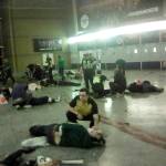 Helpers attend to injured people inside the Manchester Arena in Britain after a blast on Monday caused by an apparent suicide bomber. (PA via AP)