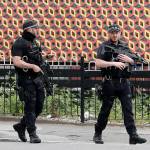 Armed police guard Victoria Station in Manchester, England, on Wednesday. (AP Photo/Kirsty Wigglesworth)