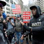 Protesters argue during a May Day protest on Monday in Seattle. (AP Photo/Ted S. Warren)