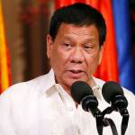 Philippine President Rodrigo Duterte speaks to the media Friday in Manila. (AP Photo/Bullit Marquez)