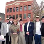 Members of the Rotary Club of Everett on May 2 gathered on the site in downtown Everett where, in spring 1917, the club received its official charter. Behind them is the former Odd Fellows Hall, built in 1912. Among the attendees are (from left) Rotarians Lyle Ryan, Larry O&rsquo;Donnell, Walt Greenwood, Deborah Wright, John Olson, Tom Rainville, Henry Newton, Ed Petersen and Ed Rubatino. (Contributed photo)