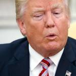 President Donald Trump talks to reporters in the Oval Office of the White House on Wednesday in Washington. (AP Photo/Evan Vucci)