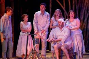 The cast of &ldquo;A Proper Place&rdquo; spends it first night on a desert island after suffering through a shipwreck. The Village Theatre show continues through May 21 in Everett.