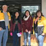 Lynnwood Kiwanis member John Baker (from left), Lynnwood Key Club members Vannie Nguyen and Annie Nguyen, and Kiwanis member Billie Swengel work at a recent food drive. (Contributed photo)