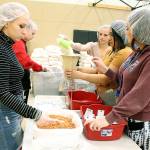 Snohomish High School students measure out ingredients for dinner packets at a Fight Against Hunger event May 10. (Contributed photo by Tiffany Herman)