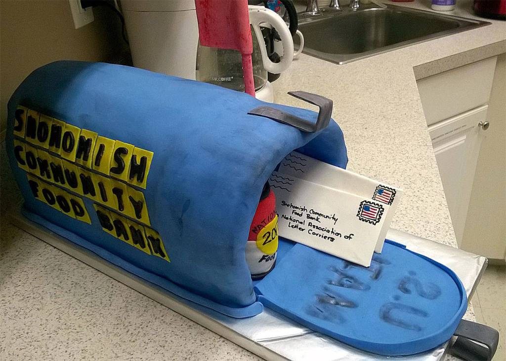 Snohomish Community Food Bank volunteers Wendi and John Otto made this mail box cake in celebration of the 2017 U.S. Postal Service Letter Carrier Food Drive. (Contributed photo)