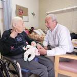 Glen Hotchkiss talks to his mother, Phyllis Hotchkiss, at her nursing home in Adrian, Michigan, in April 2016. Phyllis Hotchkiss, 93, has dementia and is confined to a wheelchair and was involuntarily discharged from her nursing home this year to one further away from her family. (Associated Press)