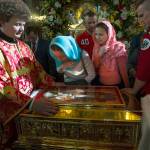 Russian Orthodox believers line up to kiss the relics of Saint Nicholas in the Christ the Savior Cathedral in Moscow, Russia, Sunday, May 21, 2017. Relics of Saint Nicholas, one of the Russian Orthodox Church&rsquo;s most revered figures, arrived in Moscow on Sunday from an Italian church where they have lain for 930 years. An icon of of Saint Nicholas in in the center. (AP Photo/Alexander Zemlianichenko)