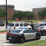 Officers work at a shooting scene on the North Lake College campus in Irving, Texas, on Wednesday, May 3. The situation prompted a lockdown at the school in the Dallas suburb. (Jae S. Lee/The Dallas Morning News via AP)
