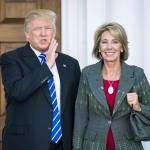 Donald Trump, then president-elect, stands with Betsy DeVos after a meeting in November 2016. (Jabin Botsford / Washington Post)