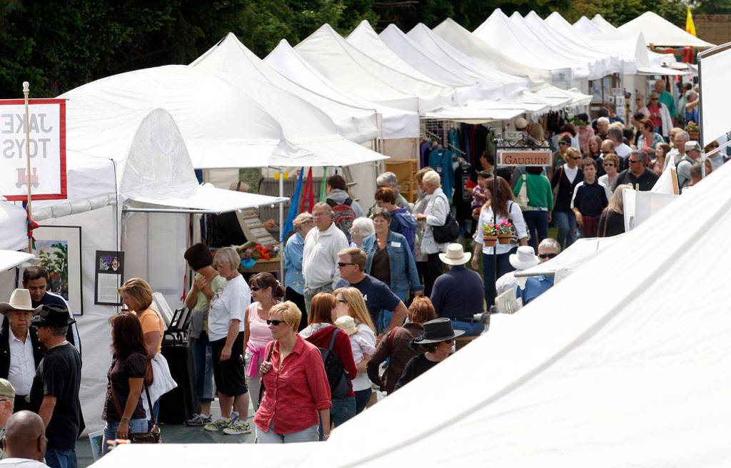 Visitors browse the hundreds of booths at the Edmonds Arts Festival. This year&rsquo;s festival is slated for June 16-18. (Herald file photo)