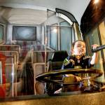 Kennedy Curtis of Lake Stevens steers an Everett Transit Bus as he speaks to imaginary passengers on an imaginary microphone at the Imagine Children&rsquo;s Museum in 2016. (Herald file photo)