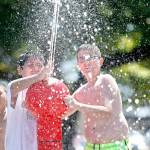 Isaias Komok, (center) and Zakary Wagner (right) aim a water cannon at Marysville&rsquo;s Spray Park in Comeford Park in 2014. (Herald file photo)