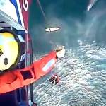This image taken from video shows the rescue of surfer Matthew Bryce. (Maritime & Coastguard Agency via AP)