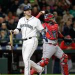 The Mariners&rsquo; Mike Zunino (left) walks back to the dugout after striking out as Angels catcher Martin Maldonado tosses the ball back to the mound in the third inning of a game May 2, 2017, in Seattle. (AP Photo/Elaine Thompson)