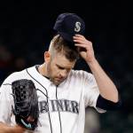Mariners starting pitcher James Paxton adjusts his cap after giving up a run to the Angels in the fifth inning of a game May 2, 2017, in Seattle. (AP Photo/Elaine Thompson)