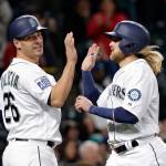The Mariners&rsquo; Danny Valencia (left) and Taylor Motter share congratulations after both scored in the seventh inning of a game against the Rangers on May 6, 2017, in Seattle. (AP Photo/Elaine Thompson)