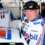 Driver Clint Bowyer climbs into his car during practice for the Monster Cup race at Kansas Speedway on May 12, 2017, in Kansas City, Kan. (AP Photo/Colin E. Braley)