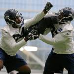 Seahawks defensive tackles Malik McDowell (left) and Jeremy Liggins take part in a drill during rookie minicamp on May 12, 2017, in Seattle. (AP Photo/Ted S. Warren)