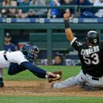 The White Sox&rsquo;s Melky Cabrera (53) slides safely home to score on a double by Avisail Garcia despite the tag attempt from Mariners catcher Carlos Ruiz in the fourth inning of a game May 20, 2017, in Seattle. (AP Photo/Ted S. Warren)