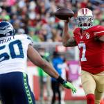 Former 49ers quarterback Colin Kaepernick (7) passes against Seahawks outside linebacker K.J. Wright (50) during the first half of a game Jan. 1, 2017, in Santa Clara, Calif. (AP Photo/Tony Avelar)