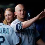 The Mariners&rsquo; Kyle Seager (center) is congratulated by teammates as he returns to the dugout after scoring against the Rockies in the third inning of a game May 30, 2017, in Denver. (AP Photo/David Zalubowski)