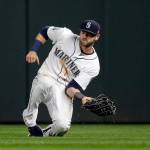 Mariners right fielder Mitch Haniger makes a sliding catch during a game against the Astros on April 12, 2017, in Seattle. (AP Photo/Elaine Thompson)
