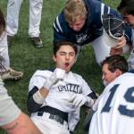 Glacier Peak&rsquo;s Riley Parker (center) celebrates after his game-winning RBI beat Jackson in a 4A playoff game May 13, 2017, at Meridian Park in Shoreline. (Kevin Clark / The Herald)