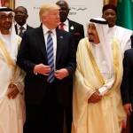 President Donald Trump talks with Saudi King Salman as they pose for photos with leaders at the Arab Islamic American Summit, at the King Abdulaziz Conference Center, Sunday, May 21, 2017, in Riyadh, Saudi Arabia. Jordan&rsquo;s King Abdallah II stands at right. (AP Photo/Evan Vucci)