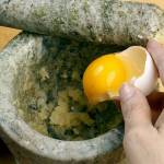 Add the egg yolk, if you&rsquo;re using it. The yolk will help emulsify the sauce. (Michael Tercha/Chicago Tribune)