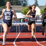 Kevin Clark / The Herald                                Sidney Trinidad of Arlington (left) crosses the finish line to win the 3A girls 100-meter hurdles final Friday at the state track and field championships at Mount Tahoma High School. Lynnwood&rsquo;s Rita Sakharov (center) placed fourth and Shorecrest&rsquo;s Marieke Visscher (right) was seventh.