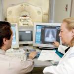 Dr. Claudia Henschke, chief of the Division of Chest Imaging, right, and CT supervisor Gus Daphnis, show in 2005 photo, watch the lung scan of a patient at New York Hospital-Cornell Medical Center in New York. (Associated Press / Richard Drew)