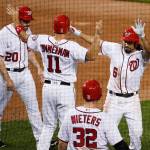 Anthony Rendon of the Washington Nationals (6) is congratulated by his teammates after hitting a three-run home run Tuesday against the Seattle Mariners. Rendon homered twice in the game. (AP Photo/Manuel Balce Ceneta)
