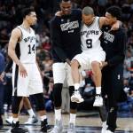 San Antonio Spurs guard Tony Parker (9) is carried off the court after suffering an injury in the fourth quarter of Wednesday night&rsquo;s NBA playoff game against the Houston Rockets. (Karen Warren/Houston Chronicle via AP)