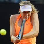 Maria Sharapova, of Russia, returns a shot to Mirjana Lucic-Baroni, of Croatia, on Tuesday during the Italian Open tennis tournament in Rome. Sharapova later retired from the match because of a thigh injury.(AP Photo/Andrew Medichini)