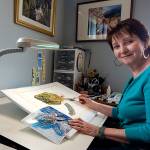 Gale Fiege / The Herald Nicki Wight at work in her studio on Camano Island.