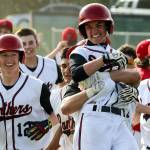 Snohomish&rsquo;s Chase Taylor is lifted by teammate Josh Johnston after beating Marysville Pilchuck 5-4 in a winner-to-state, loser-out district game on May 10, 2017, at Earl Torgeson Field in Snohomish. (Kevin Clark / The Herald)