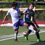 Kamiak&rsquo;s Manuel Segura (left) and Lake Stevens&rsquo; Kameron Jackson vie for control of the ball during Saturday&rsquo;s 4A District 1 match in Mukilteo. Segura&rsquo;s goal won the match for the Knights 1-0. (Kevin Clark / The Herald)