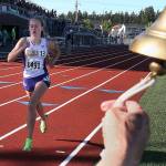 Lake Stevens sophomore Taylor Roe makes her way through the lap bell to take first place in the 1,600 meters during the state track and field championships on May 25, 2017, at Mount Tahoma High School. (Kevin Clark / The Herald)