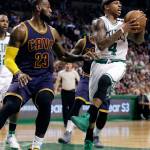 Elise Amendola / Associated Press                                Celtics guard Isaiah Thomas (4) tries to move the ball in front of Cavaliers forward LeBron James (23) during Game 2 of the NBA Eastern Conference finals on Friday in Boston.