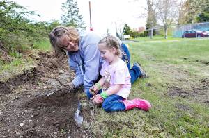 Danielle and Leena Endecott prepare the ground at a tree-planting event at Alderwood Early Childhood Center. (Contributed photo)