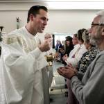 Pastor Kevin Craik conducts an Easter Sunday service at his new All Saints Church in Everett on April 15. (Ian Terry / The Herald)